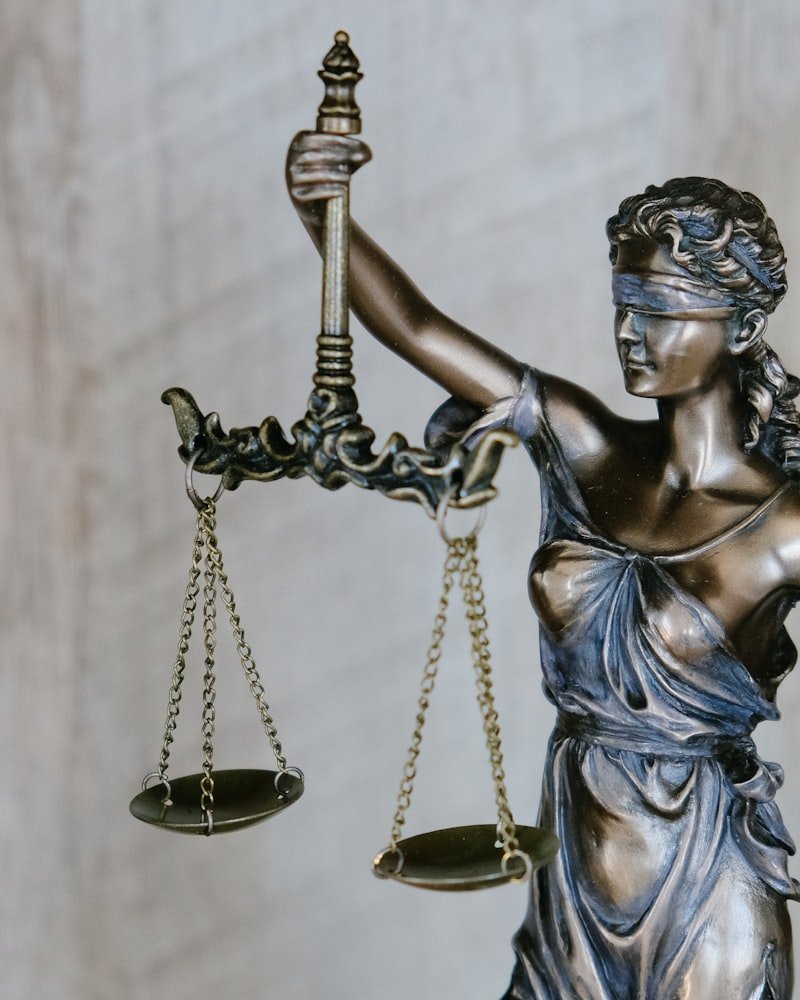 Scales of justice on a lawyer's desk, representing personal injury representation in Ottawa